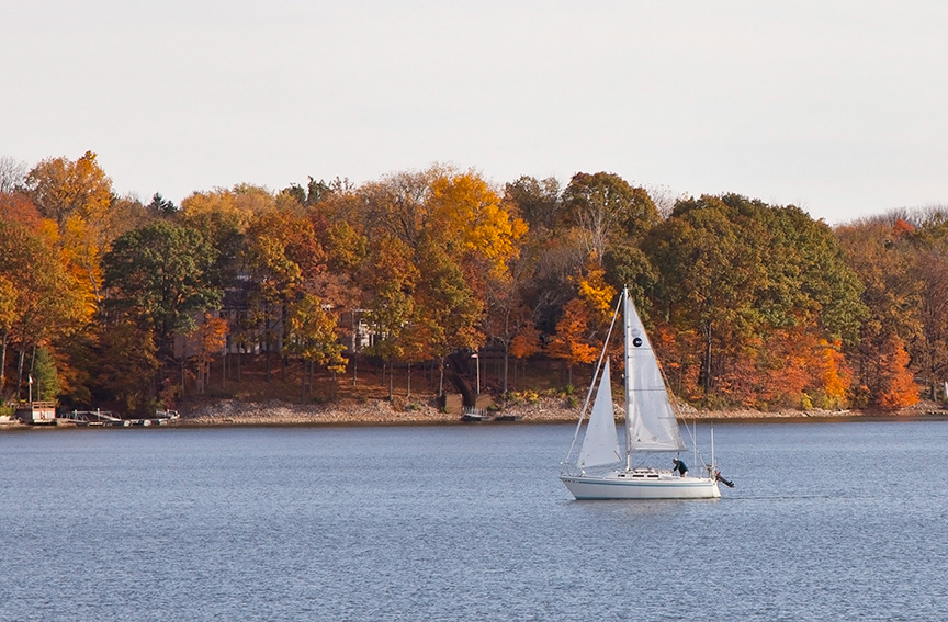 Small white sailboat on the water at Eagle Creek