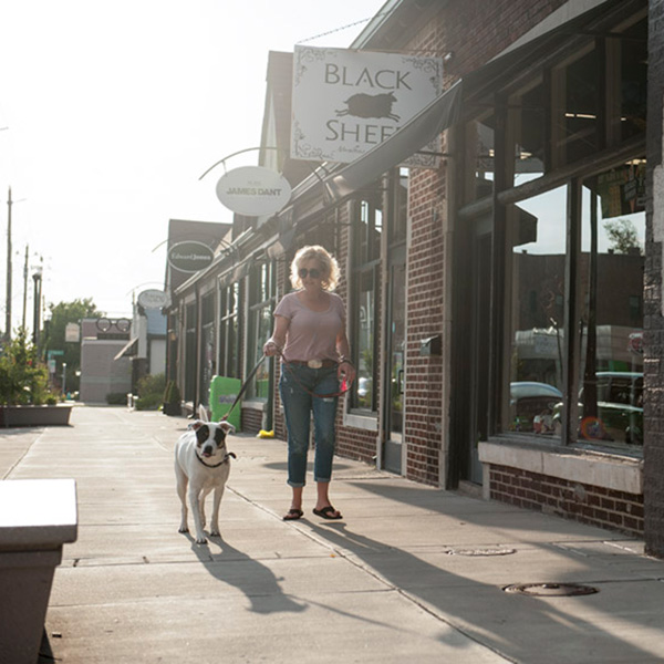 Woman walking her dog in the Irvington Historic District