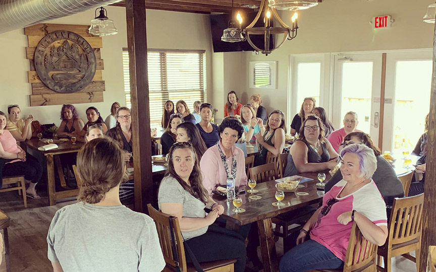 Gathering of women at Guggman Haus for Girls Pint Out