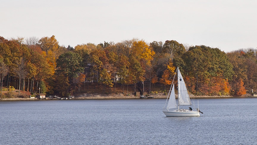 Sail boat on Eagle Creek Reservoir in the fall 