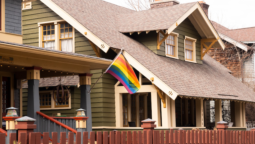 Homes in Meridian Park with a pride flag 