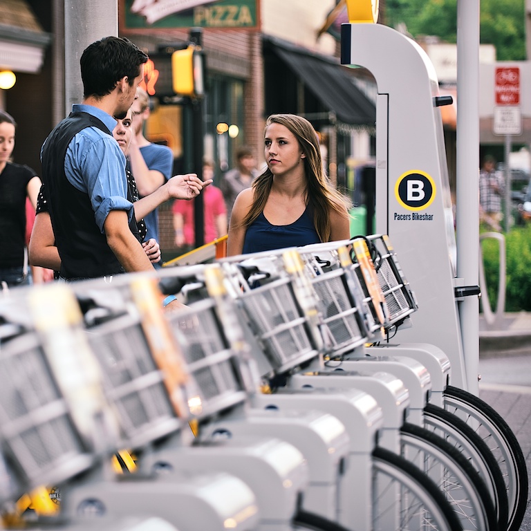 People in front of an Indiana Pacers Bikeshare station