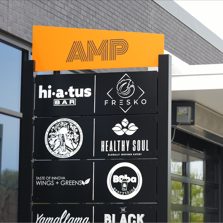Sign for the AMP food hall