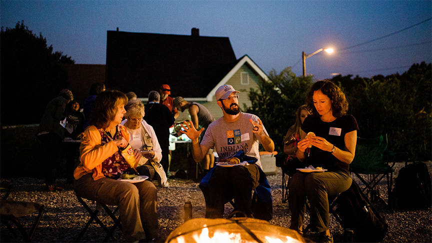 People talking around a campfire at an Indiana Humanities event