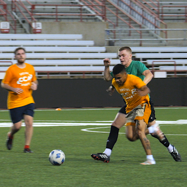 Players running after the ball in a CCA soccer game