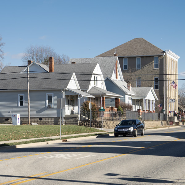 Wide shot of houses on a street in New Palestine