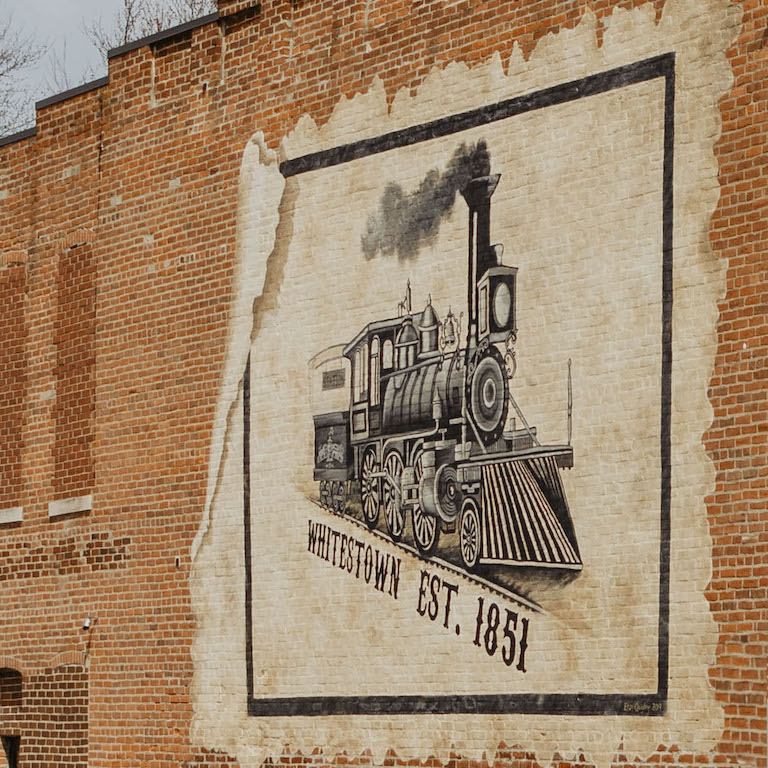 Mural of a train in honor of the Whitestown establishment