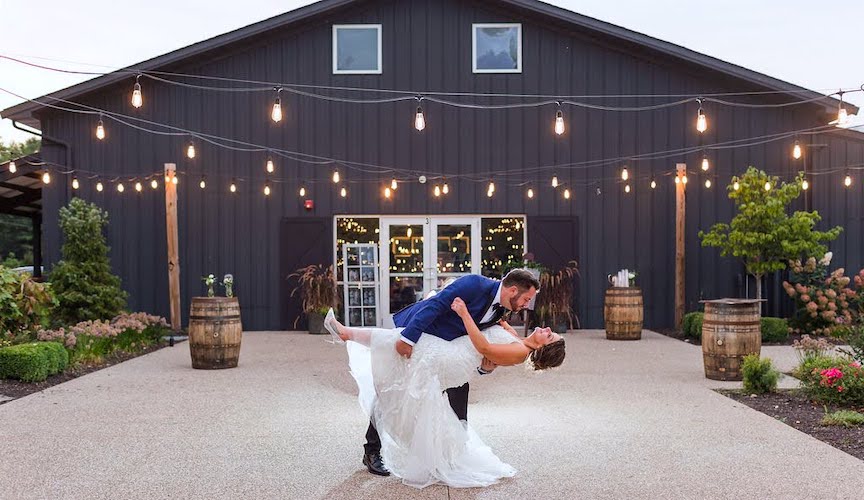 Groom dips bride at Finley Creek Vineyards wedding venue