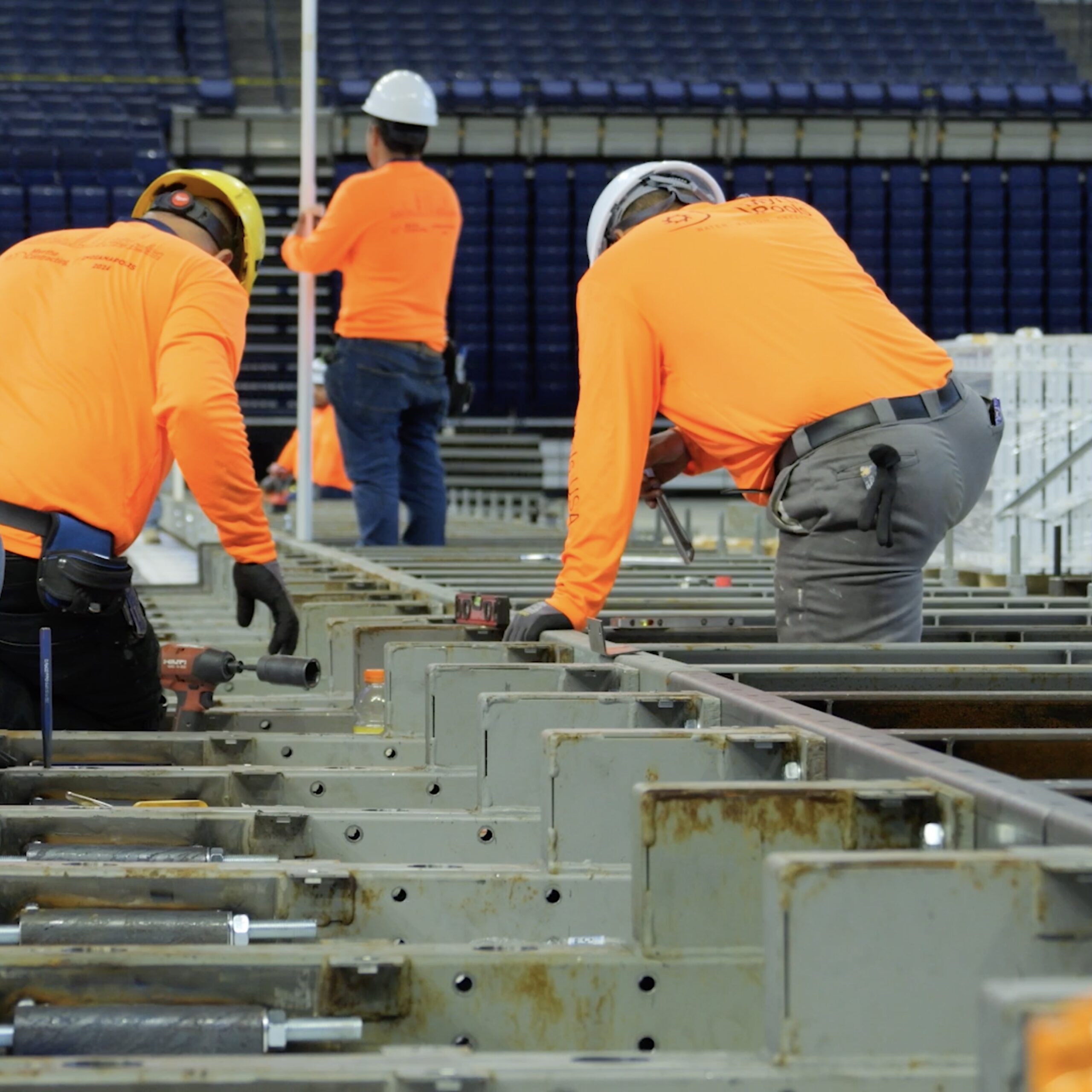 Workers building the pool in Lucas Oil Stadium