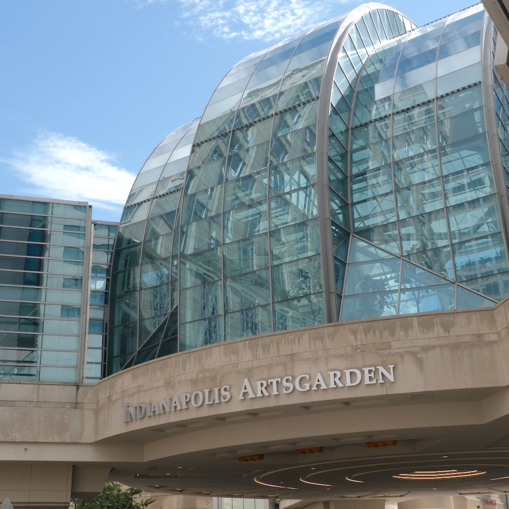 Exterior of the Indianapolis Artsgarden, a glass building suspended above an intersection