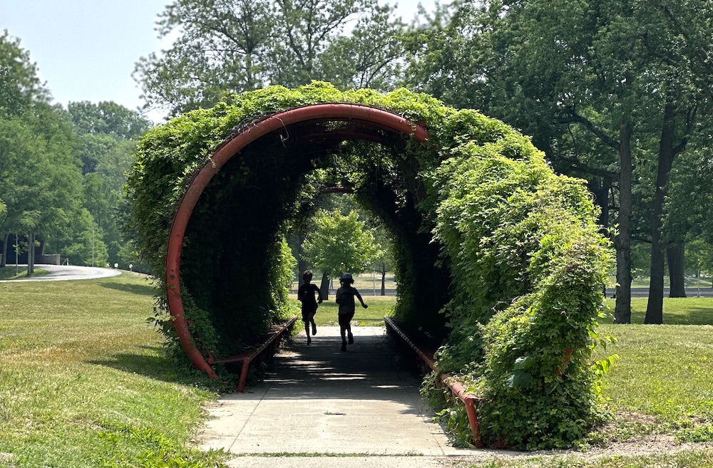 Kids playing in a tunnel in a park